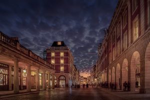 An evening at Covent Garden, people walking, lovely clouds in the sky, windows illuminated, London, Great Britain,