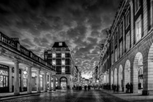 An evening at Covent Garden, people walking, lovely clouds in the sky, windows illuminated, black and white, London, Great Britain,